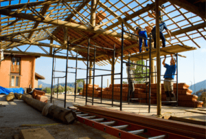People working on natural building structure
